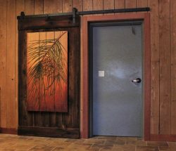 #35 Slicing barn door with carved pine bough